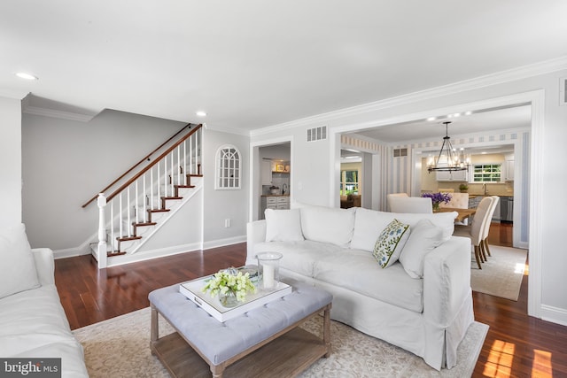 106 Debaran Ln, Bryn Mawr, PA 19010 - living room with a chandelier, crown molding, wood finished floors, stairs, and baseboards
