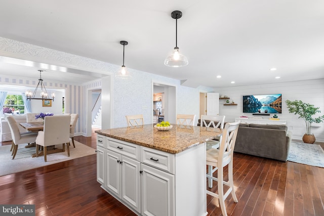106 Debaran Ln, Bryn Mawr, PA 19010 - kitchen featuring dark wood finished floors, a breakfast bar, open floor plan, white cabinets, and a chandelier