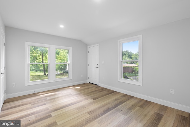 6005 Reed St, Landover, MD 20785 - empty room with plenty of natural light, baseboards, light wood finished floors, vaulted ceiling, and recessed lighting