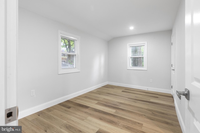 6005 Reed St, Landover, MD 20785 - empty room featuring healthy amount of natural light, light wood finished floors, baseboards, recessed lighting, and vaulted ceiling
