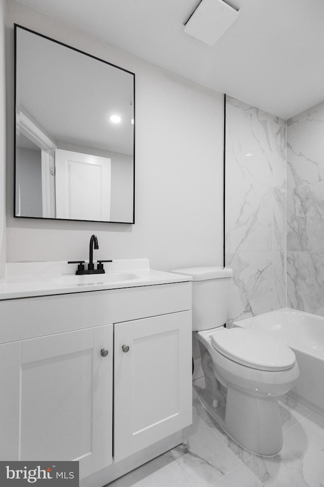 6005 Reed St, Landover, MD 20785 - bathroom with marble look tile flooring, toilet, vanity, and a tub