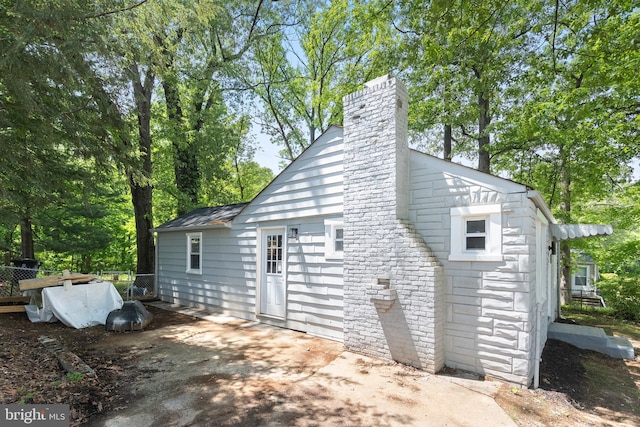 6005 Reed St, Landover, MD 20785 - view of property exterior with fence and a chimney