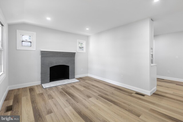 6005 Reed St, Landover, MD 20785 - unfurnished living room with a fireplace, light wood-style floors, vaulted ceiling, baseboards, and recessed lighting