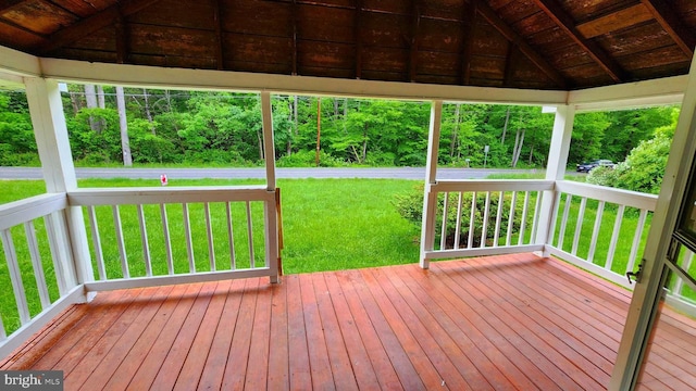 wooden terrace featuring a gazebo, a yard, and a porch