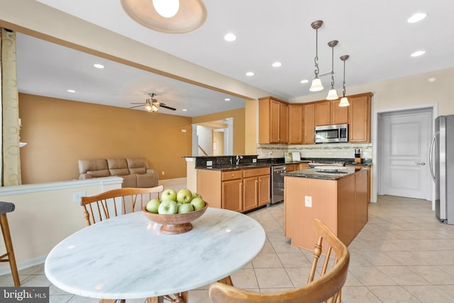 217 Liberty Trail Ct W, Fountainville, PA 18923 - kitchen with stainless steel appliances, a kitchen island, decorative backsplash, recessed lighting, and light tile patterned flooring