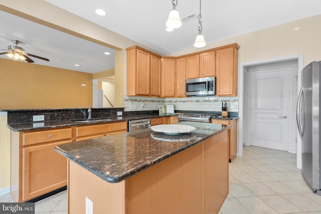 217 Liberty Trail Ct W, Fountainville, PA 18923 - kitchen featuring stainless steel appliances, a sink, ceiling fan, tasteful backsplash, and light tile patterned floors