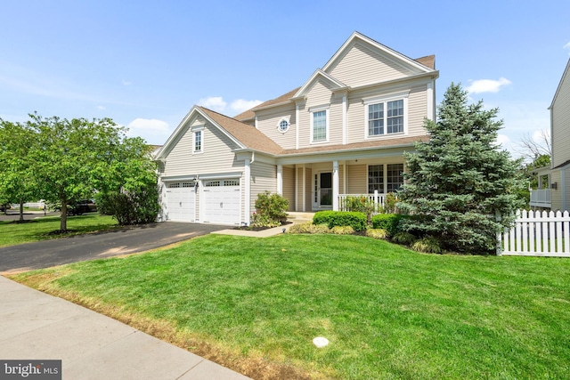 217 Liberty Trail Ct W, Fountainville, PA 18923 - traditional-style home featuring covered porch, asphalt driveway, and a garage
