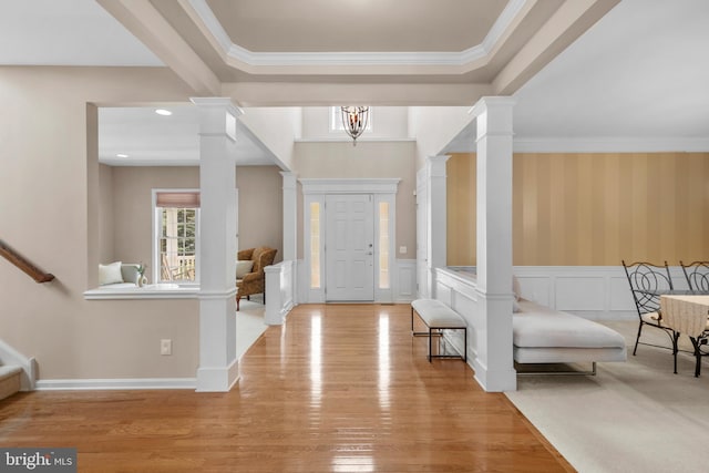 217 Liberty Trail Ct W, Fountainville, PA 18923 - entryway with wood finished floors, decorative columns, stairs, wainscoting, and crown molding