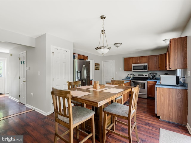 325 Chandler Dr, Shepherdstown, WV 25443 - dining area featuring dark wood-style floors and baseboards