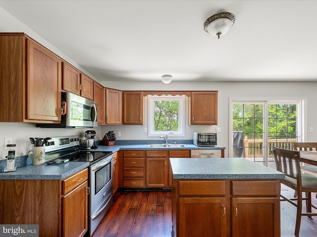 325 Chandler Dr, Shepherdstown, WV 25443 - kitchen featuring appliances with stainless steel finishes, a sink, dark wood-type flooring, and dark countertops