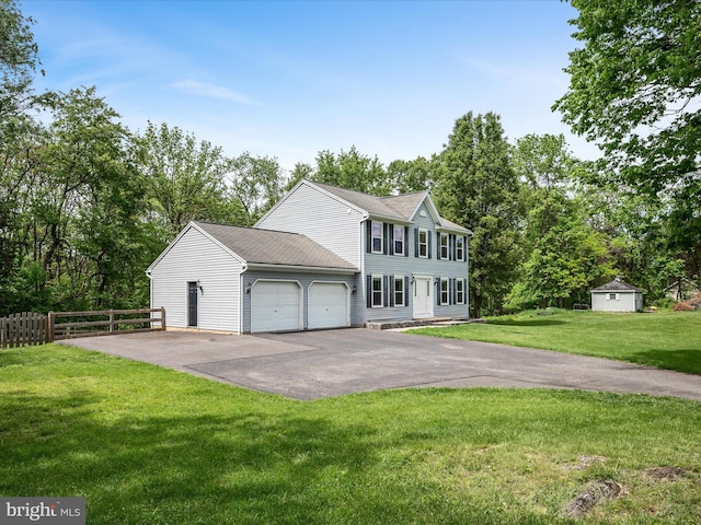 325 Chandler Dr, Shepherdstown, WV 25443 - colonial-style house with driveway, a garage, and view of wooded area