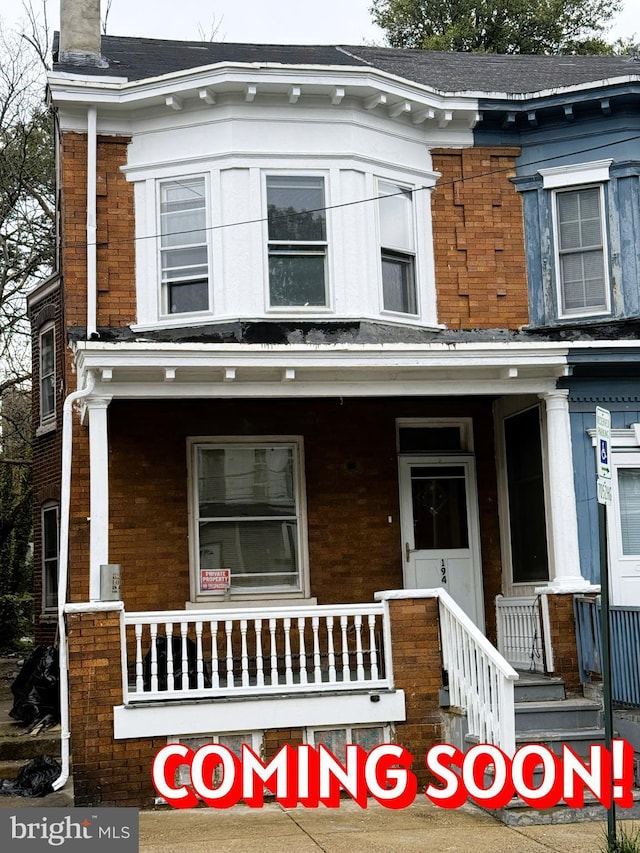 194 Rosemont Ave, Trenton, NJ 08618 - townhome / multi-family property with covered porch, brick siding, and a chimney