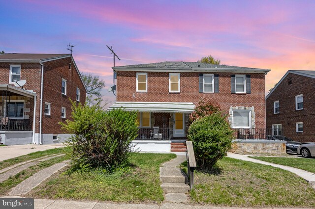 3010 Woodring Ave, Baltimore, MD 21234 - townhome / multi-family property with covered porch and brick siding