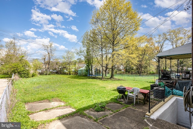 3010 Woodring Ave, Baltimore, MD 21234 - view of yard with a trampoline and a patio area