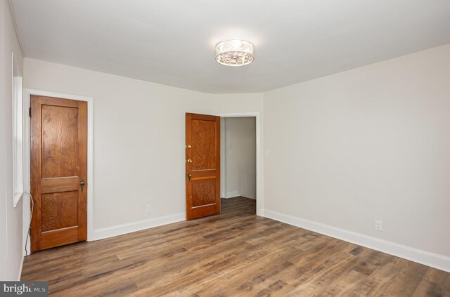3010 Woodring Ave, Baltimore, MD 21234 - empty room with wood finished floors and baseboards