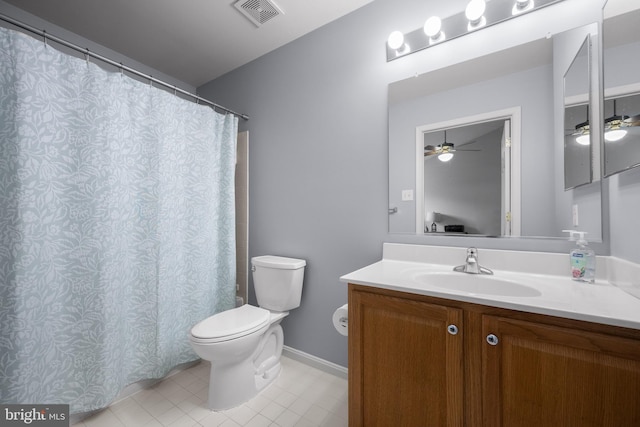 full bathroom featuring toilet, vanity, a ceiling fan, tile patterned flooring, and baseboards