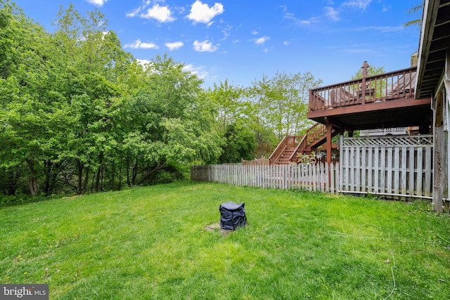 view of yard featuring stairs and a deck