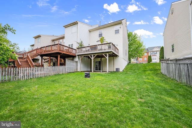 back of property with a wooden deck and cooling unit