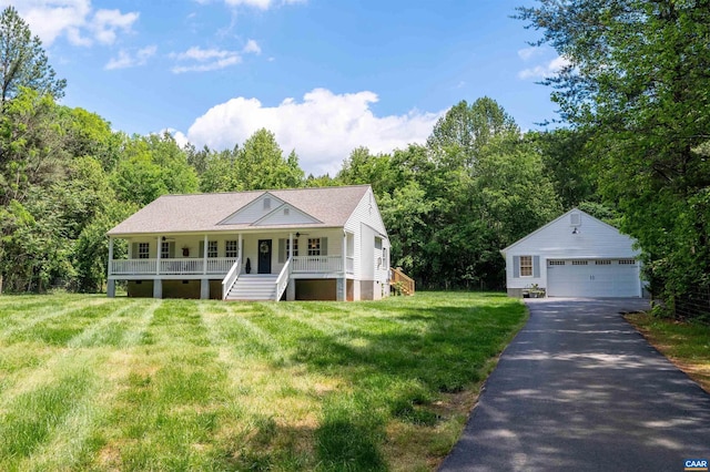 ranch-style house with a detached garage, an outdoor structure, covered porch, a front lawn, and stairs