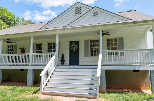 view of front facade with a porch, ceiling fan, a shingled roof, and stairs
