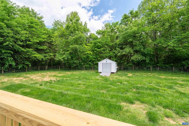 view of yard with a storage shed and an outbuilding