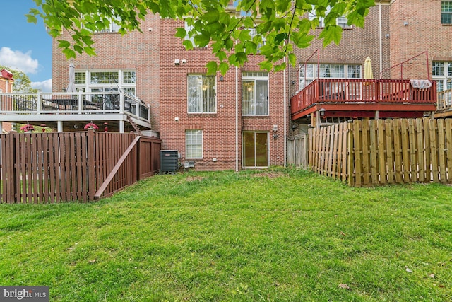 11727 Tuscany Dr, Laurel, MD 20708 - rear view of house with central air condition unit, brick siding, and a wooden deck