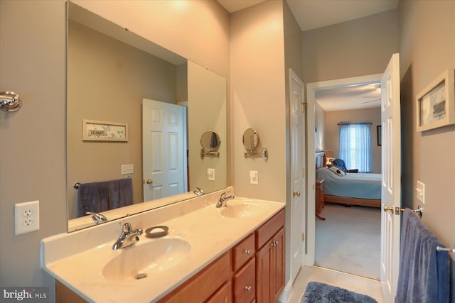 ensuite bathroom with tile patterned flooring and double vanity