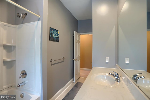 full bath featuring shower / tub combination, vanity, and baseboards