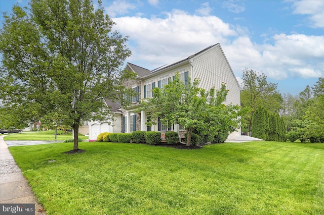view of side of home featuring a lawn