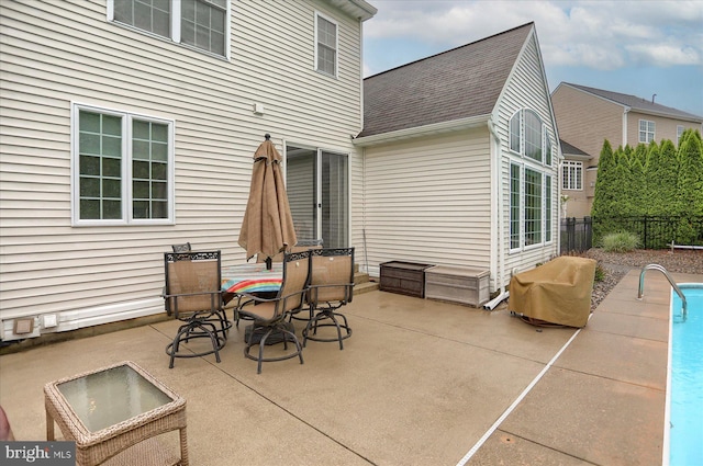 view of patio with fence and area for grilling