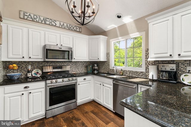 336 Deerpath Ave SW, Leesburg, VA 20175 - kitchen with appliances with stainless steel finishes, a sink, vaulted ceiling, a chandelier, and white cabinets