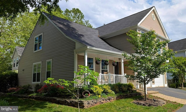 336 Deerpath Ave SW, Leesburg, VA 20175 - view of front facade with a porch, a garage, and driveway