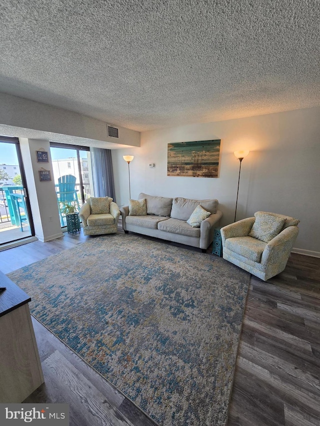 13100 Coastal Hwy Unit 1110, Ocean City, MD 21842 - living area featuring a textured ceiling and wood finished floors