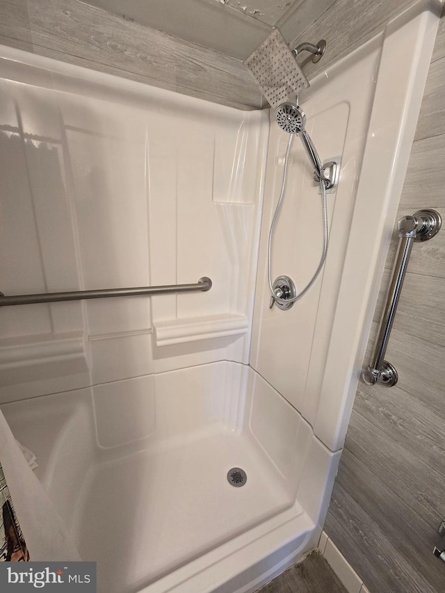 13100 Coastal Hwy Unit 1110, Ocean City, MD 21842 - full bathroom with a shower and wood finished floors