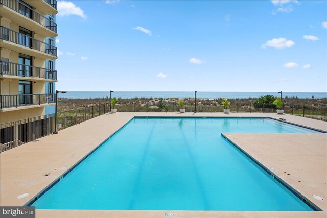 13100 Coastal Hwy Unit 1110, Ocean City, MD 21842 - community pool featuring a water view and fence