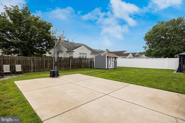 view of patio / terrace featuring a storage unit and an outbuilding