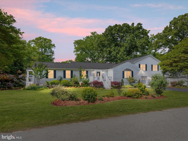 2039 Choptank Ave, Pasadena, MD 21122 - view of front of house featuring asphalt driveway, a lawn, and an attached garage