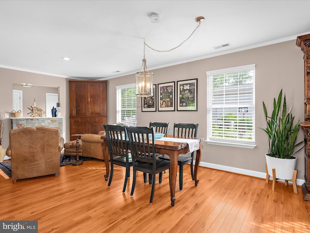 2039 Choptank Ave, Pasadena, MD 21122 - dining space with light wood-style floors, ornamental molding, baseboards, a chandelier, and recessed lighting