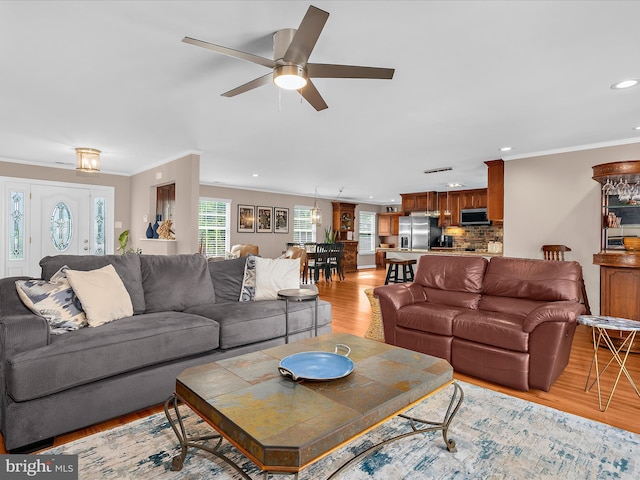 2039 Choptank Ave, Pasadena, MD 21122 - living area with light wood-type flooring, recessed lighting, ornamental molding, and ceiling fan
