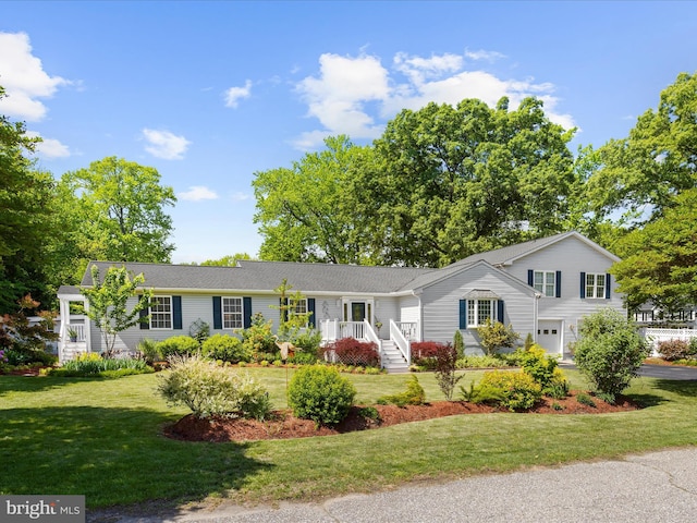 2039 Choptank Ave, Pasadena, MD 21122 - view of front facade featuring an attached garage, a front lawn, and driveway