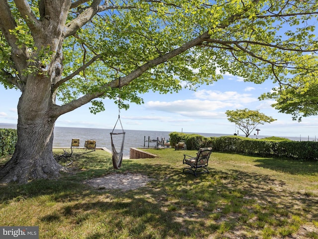 2039 Choptank Ave, Pasadena, MD 21122 - view of grassy yard with a water view and a dock