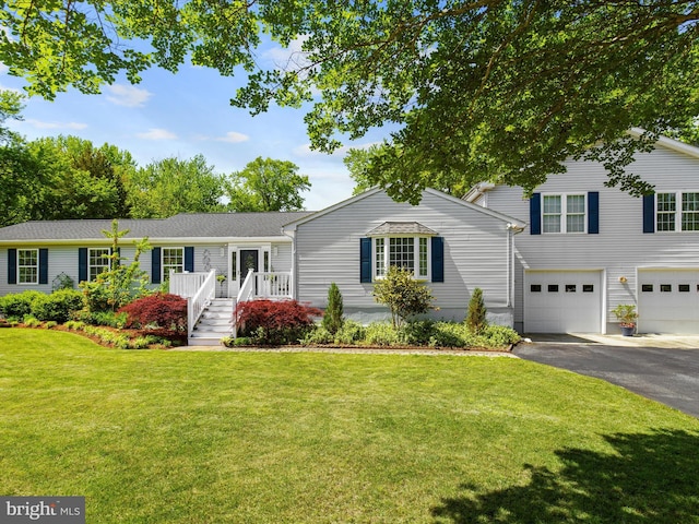 2039 Choptank Ave, Pasadena, MD 21122 - view of front of property with asphalt driveway, a front lawn, and a garage