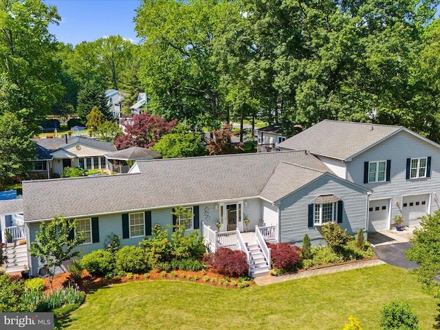 2039 Choptank Ave, Pasadena, MD 21122 - traditional home with a garage, driveway, a shingled roof, and a front lawn