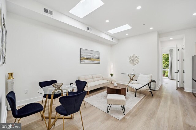 705 Quincy St NE Unit 5D, Washington, DC 20017 - living room with a skylight, light wood-style floors, recessed lighting, and baseboards
