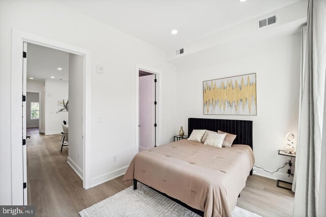 705 Quincy St NE Unit 5D, Washington, DC 20017 - bedroom featuring wood finished floors, recessed lighting, and baseboards