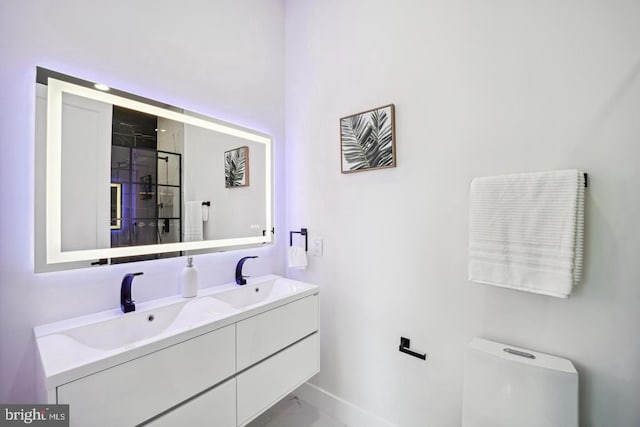 705 Quincy St NE Unit 5D, Washington, DC 20017 - full bathroom featuring marble finish flooring, toilet, a shower stall, baseboards, and double vanity