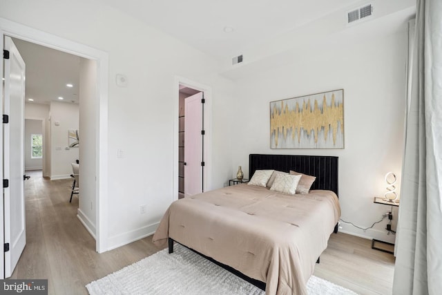 705 Quincy St NE Unit 5D, Washington, DC 20017 - bedroom with light wood-type flooring, baseboards, and recessed lighting