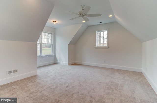 additional living space with lofted ceiling, baseboards, carpet flooring, recessed lighting, and a ceiling fan