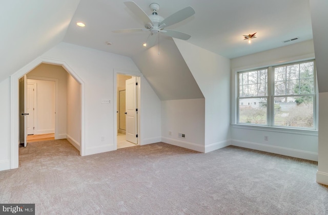 additional living space with carpet flooring, lofted ceiling, recessed lighting, baseboards, and ceiling fan