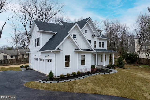 view of front facade featuring a garage, board and batten siding, driveway, a porch, and a shingled roof